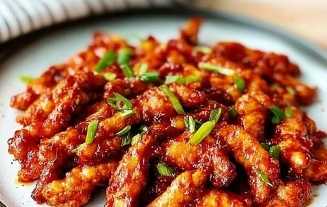Delicious Dragon Chicken served with rice - sweet, spicy, and sticky dish