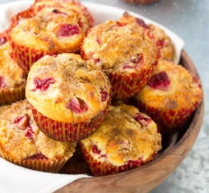 Mango Strawberry Sunset Cupcakes decorated with fresh fruit and creamy frosting